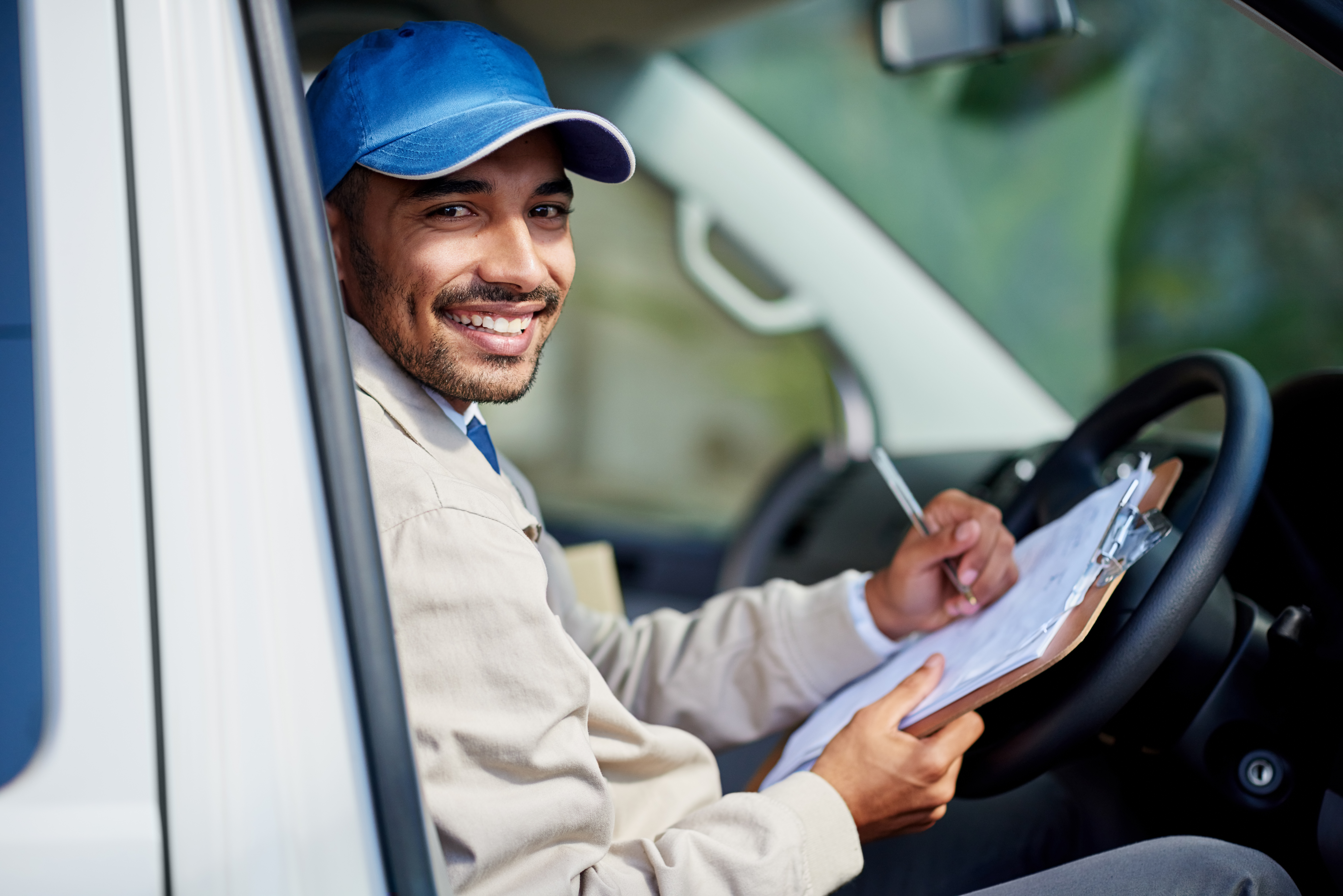 Man smiling working on paperwork